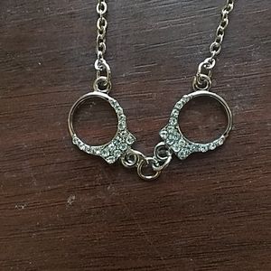 Hand cuff charmed necklace